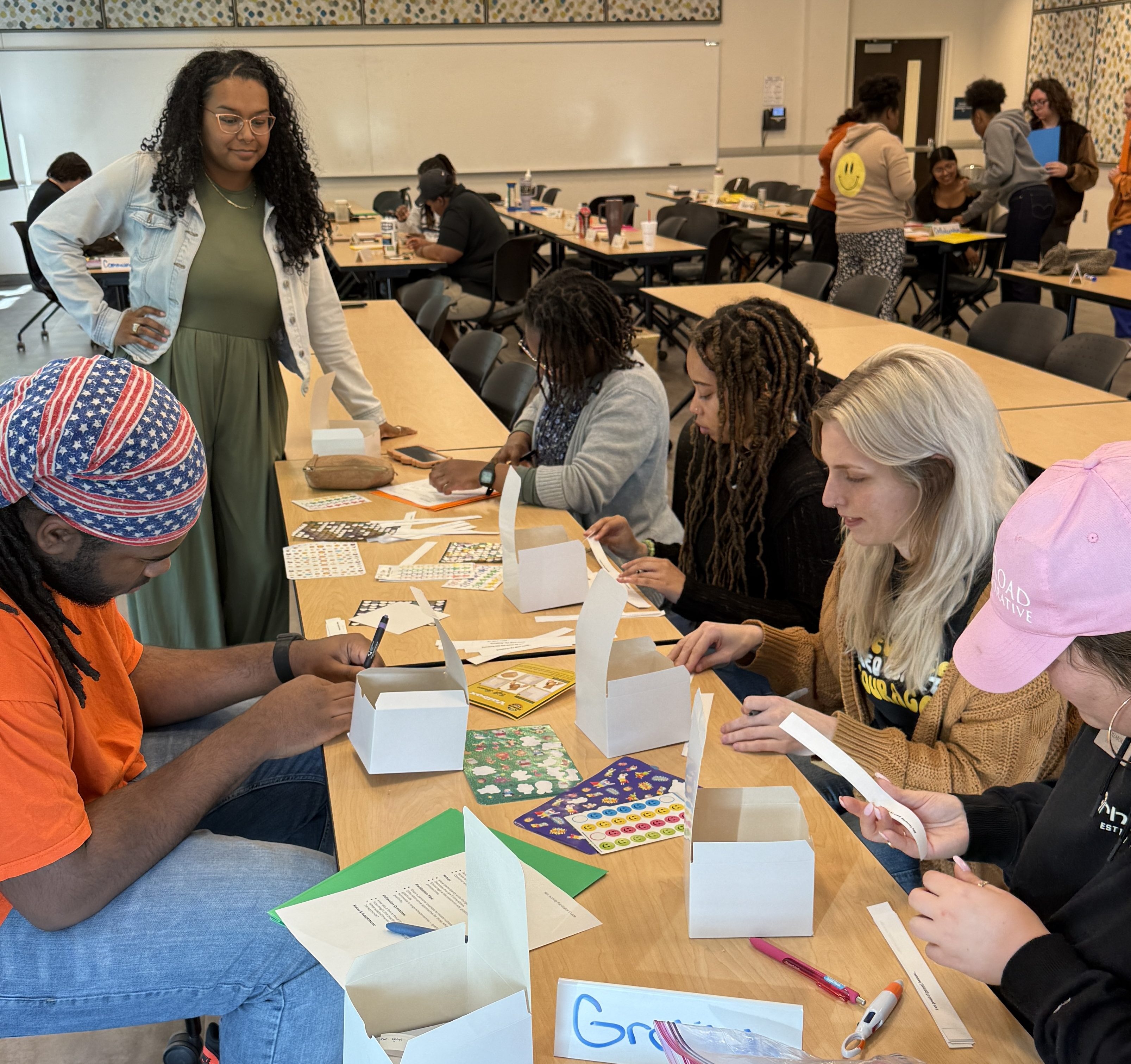 Emani guiding participants through a creative group activity.
